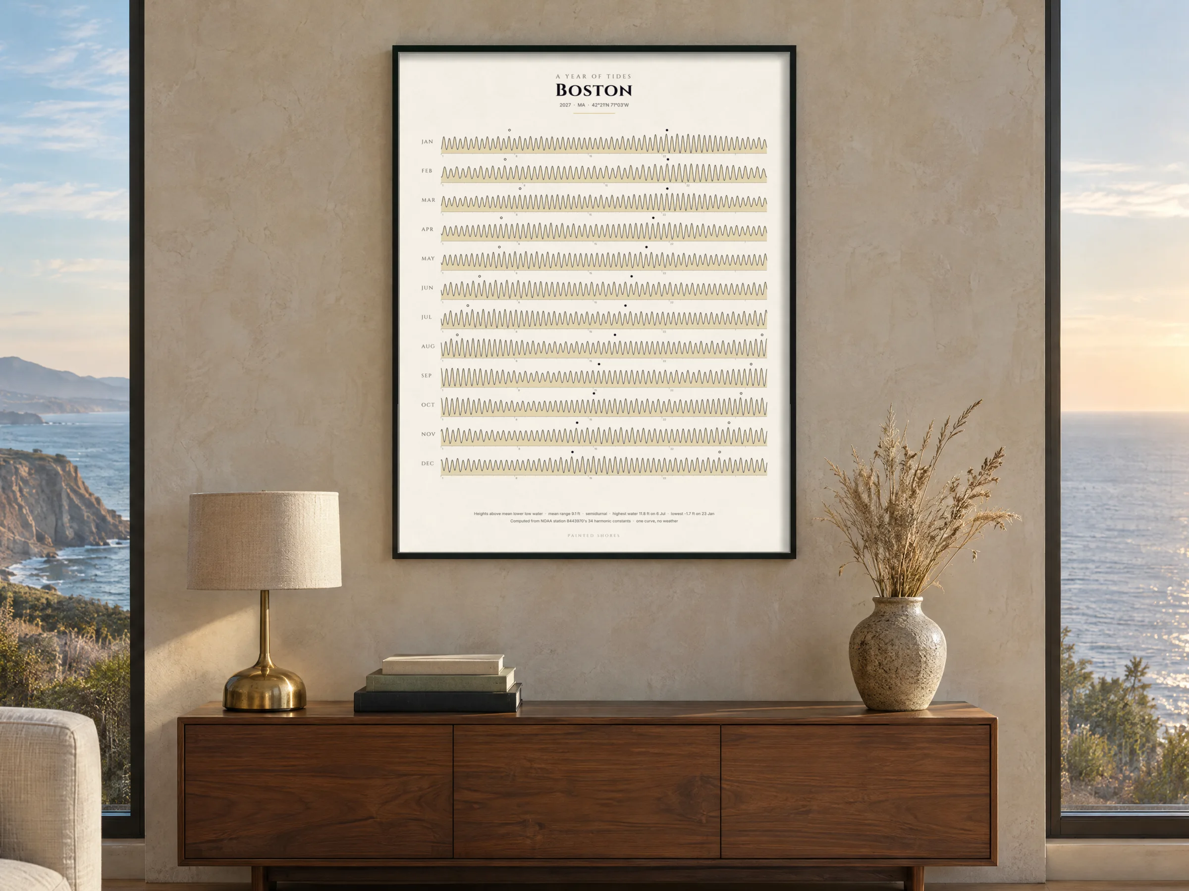The ribbon of Boston Harbor's year in a thin black frame above a walnut console with a brass lamp, in a living room of glass above the Pacific